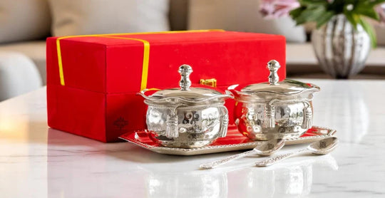 Indian Art Villa premium silverware collection – handcrafted Indian utensils, pooja items, and serveware with intricate traditional designs.