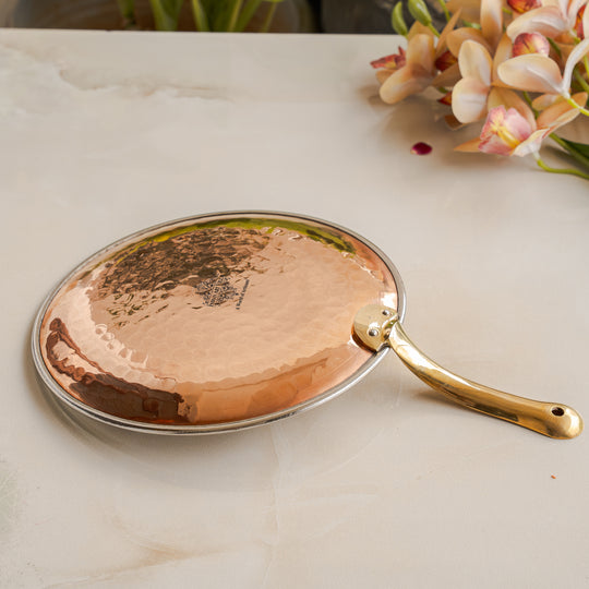 Handcrafted copper steel tawa with brass handle adding a traditional flair to your cooking experience by Indian Art Villa.