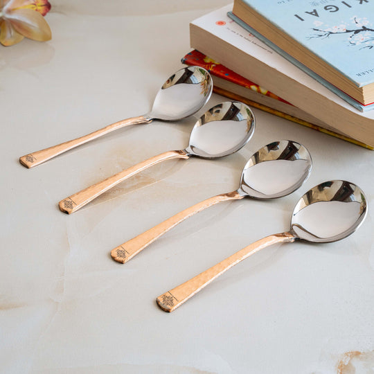 Elegant hammered copper spoons with floral engravings set of 8 ideal for soup stirring beverages and desserts.