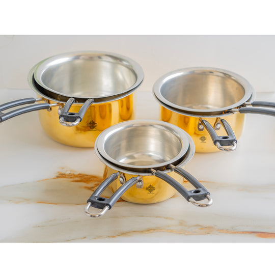 Brass cookware pot with durable brass body elegant tin lining and heat resistant long handle crafted by Indian Art Villa