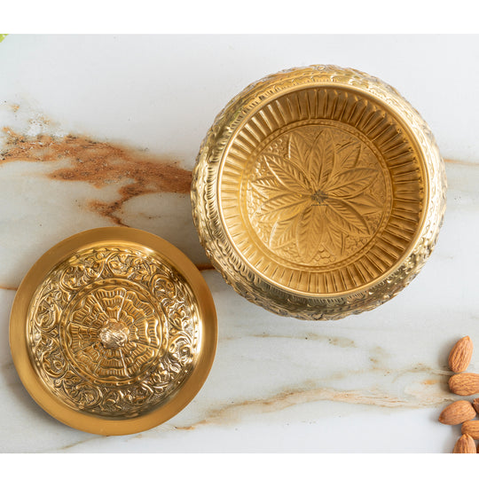 Decorative pital handi with floral embossed design on the body and lid made in pure brass with a footed base