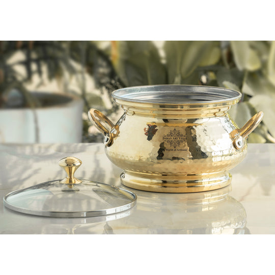 Luxury hammered brass handi with tin lining inside glass lid and curved brass handles offering traditional beauty and lasting durability