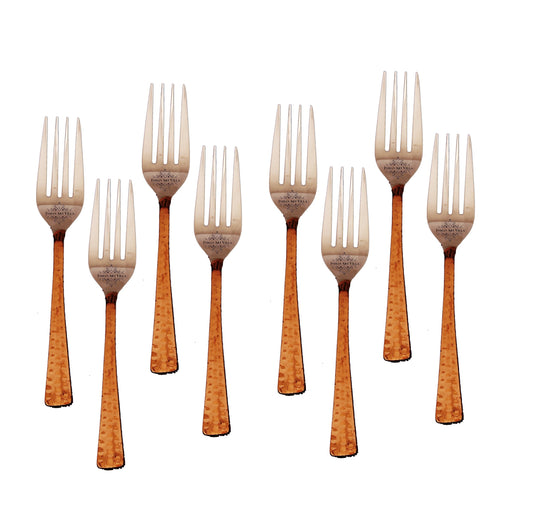 Exquisite steel copper forks with hammered texture handles offering a refined touch for both formal and casual dining experiences.