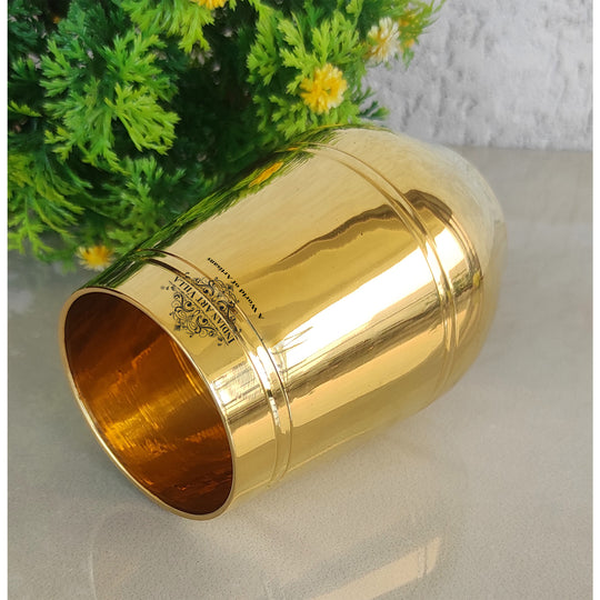 Shiny brass drinkware with curved shape and smooth golden interior crafted by Indian Art Villa for elegant table decor