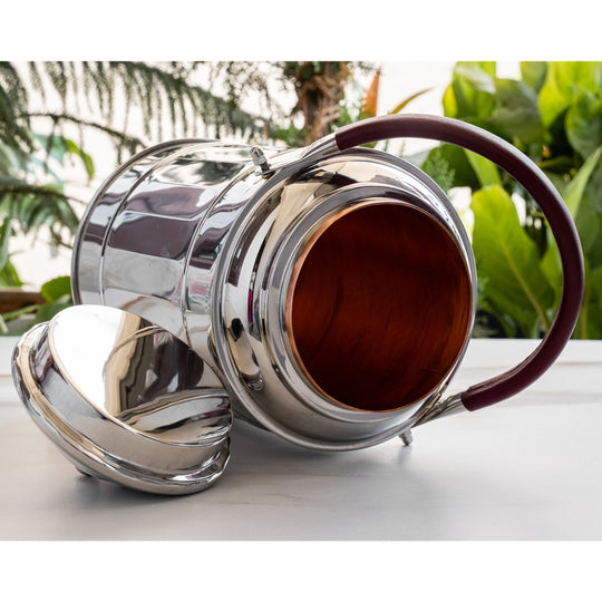 5 litre copper water dispenser in use on dining table beside copper tumbler – copper pot for drinking water