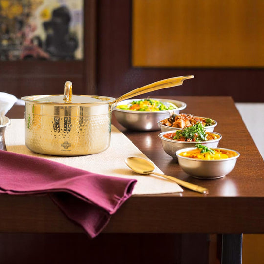 Elegant hammered brass sauce pan with long handle tin coated lining and fitted lid crafted for preparing sauces and curries