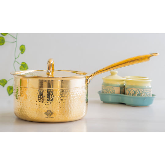 Brass sauce pan with hammered handcrafted body tin coated interior fitted brass lid on top and strong extended side handle