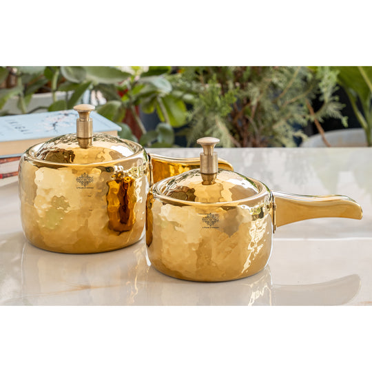 Durable stainless steel cooker with gold PVD finish and ergonomic handle