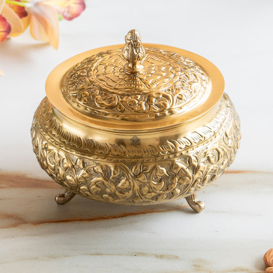 Timeless round pure brass handi with luminous body smooth contours and a designer lid that reflects Indian elegance