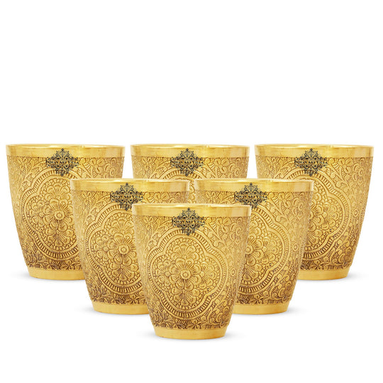 Classic brass glass set of 6 with ornate floral carvings perfect for serving beverages in style with an elegant touch.