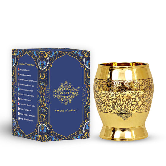 Handcrafted 300ml brass glass with an intricate floral embossing, ideal for home decor and elegant dining.