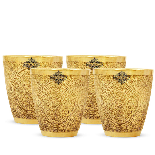 Brass glass set of 4 with delicate floral carvings perfect for serving traditional drinks with grace by inidian art villa