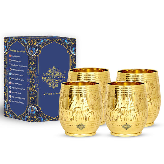 Hand-engraved leaf design on a premium brass tumbler making it a luxurious addition to collection of fine drinkware.