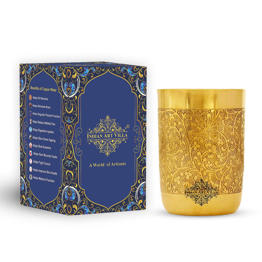 Cylindrical brass glass wrapped in floral brilliance offering a timeless feel rooted in Indian craftsmanship by IAV