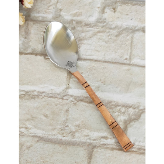Steel copper spoons by Indian Art Villa featuring a unique bamboo-like design perfect for adding style to your table.