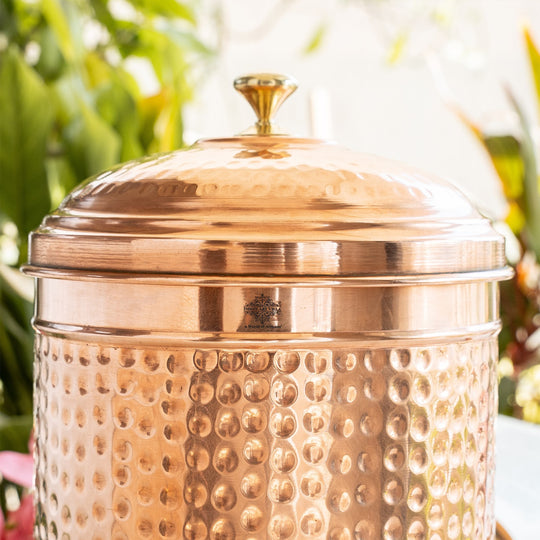 Angled front view of 5L hammered copper pot showing deep beat marks across full body