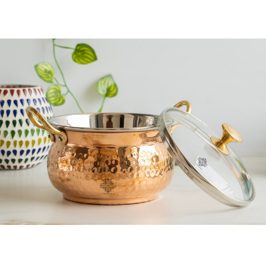 Embody tradition Indian Art Villa copper handi 950ML hammered brilliance topped by glass lid and intricate brass details