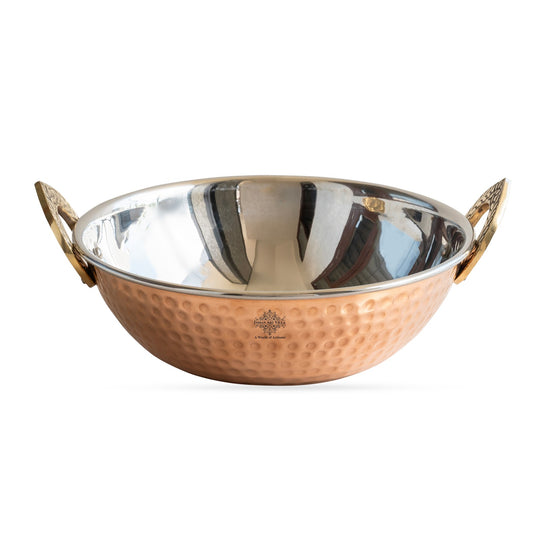 Front view steel copper hammered kadhai serveware on table