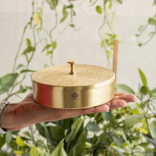 Decorative pure brass masala dabba with engraved top and seven spice compartments for gifting