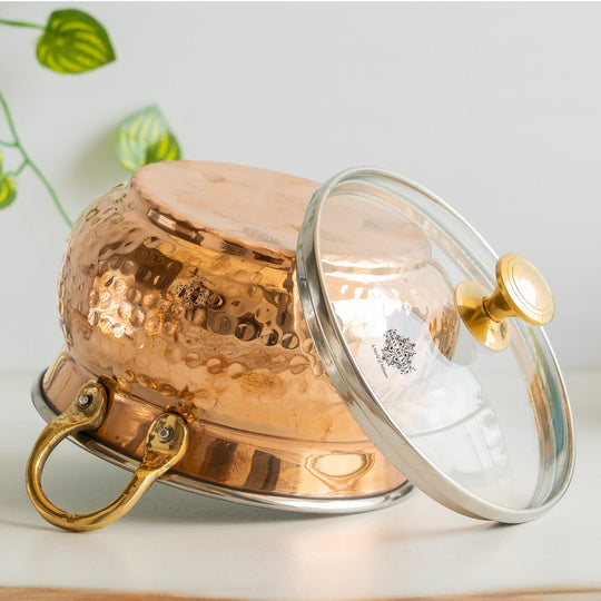 Embody tradition Indian Art Villa copper handi 950ML hammered brilliance topped by glass lid and intricate brass details