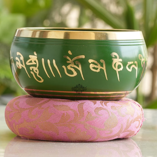 Indian Art Villa handcrafted green brass singing bowl with mantra design and cushion, ideal for meditation, healing.