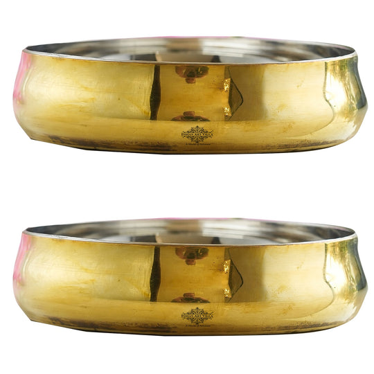 Indian Art Villa curved rice plate set crafted in steel and brass featuring a gleaming golden body and smooth steel base