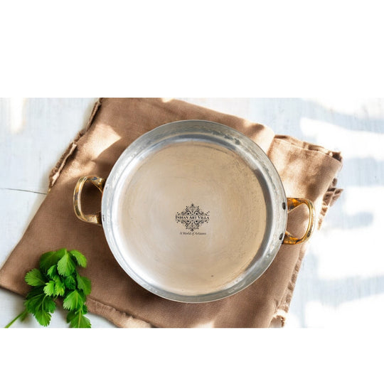 Copper pan with kalai lining and brass handles, offering superior performance and a vintage aesthetic for your kitchen