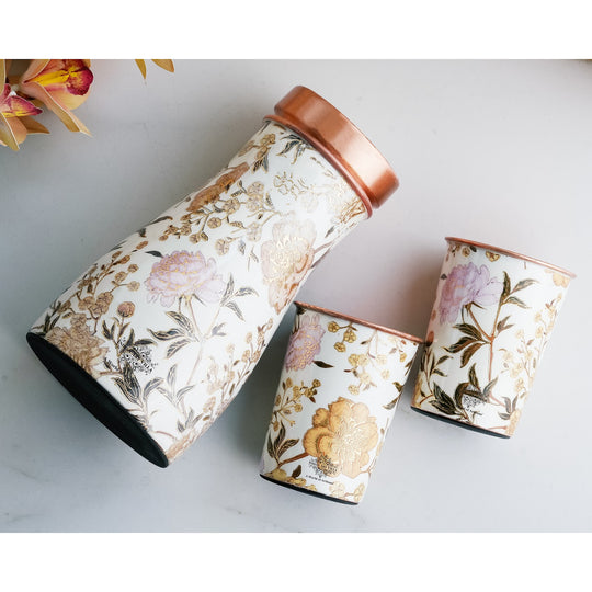 Golden floral design copper bottle and tumbler set by Indian Art Villa, ideal for festive décor and premium gifts.