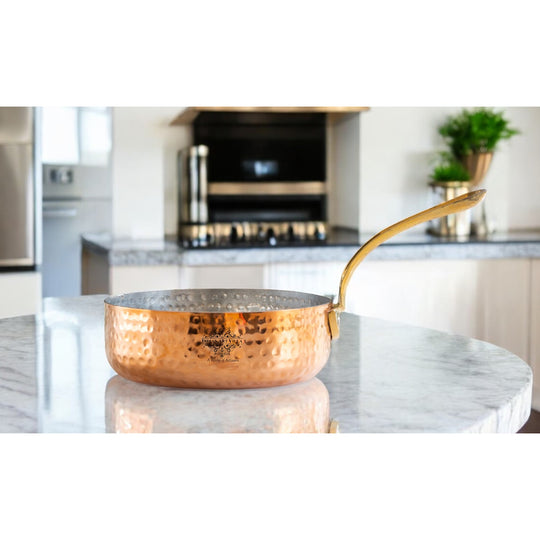 Indian Art Villa’s artisanal handcrafted copper round pan with tin lining offers a perfect balance of beauty and function