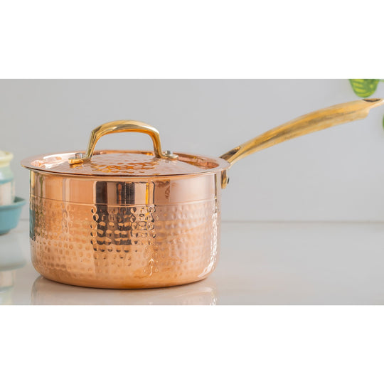 Eco-conscious copper cookware with natural tin lining and brass handle from Indian Art Villa designed for green homes