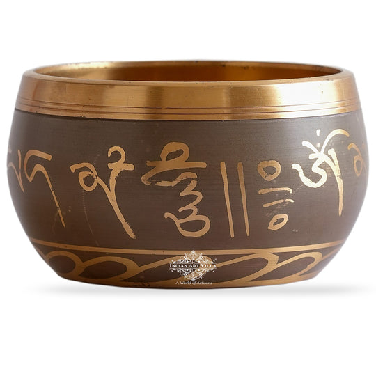 Indian Art Villa brass singing bowl with golden mantra design and cushion, ideal for meditation, sound therapy, and gifting.