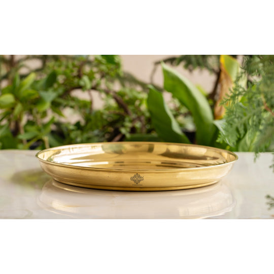 Traditional floral brass thali by Indian Art Villa best used as an urli base or centerpiece on Indian festive occasions