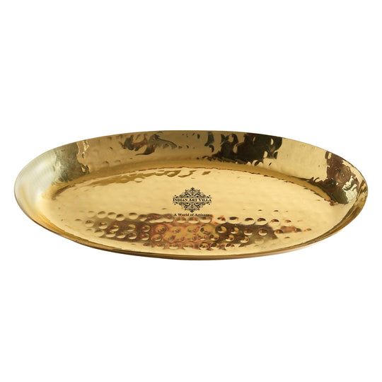Indian Art Villa brass platter crafted in oval shape with hammered surface polished finish and artisan round edging