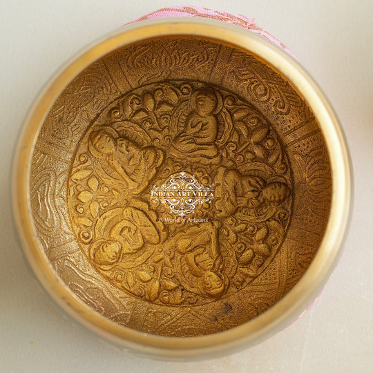 Indian Art Villa brass singing bowl with golden mantra design and cushion, ideal for meditation, sound therapy, and gifting.
