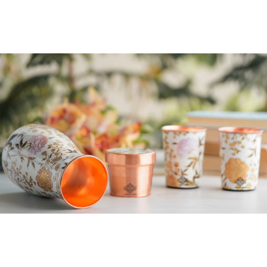 Golden floral design copper bottle and tumbler set by Indian Art Villa, ideal for festive décor and premium gifts.