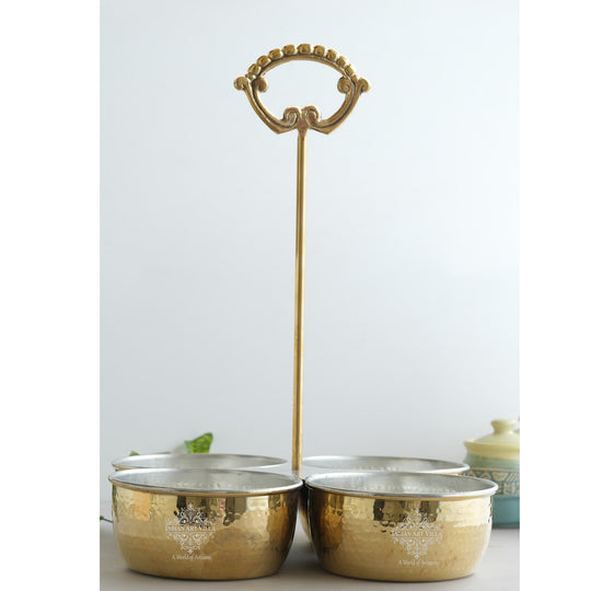 Brass vegetable serving bowl from Indian Art Villa with two hammered compartments and tall arched handle for balance