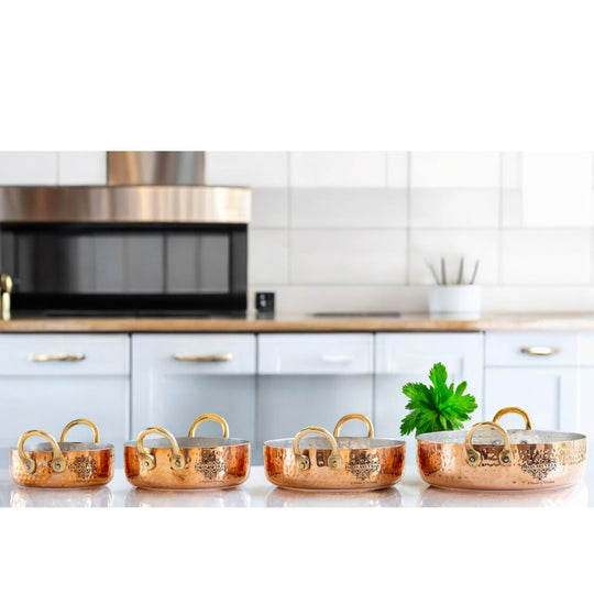 Premium copper pan set with kalai lining and brass handles, available in 300ml, 500ml, and 800ml volumes for versatile cooking