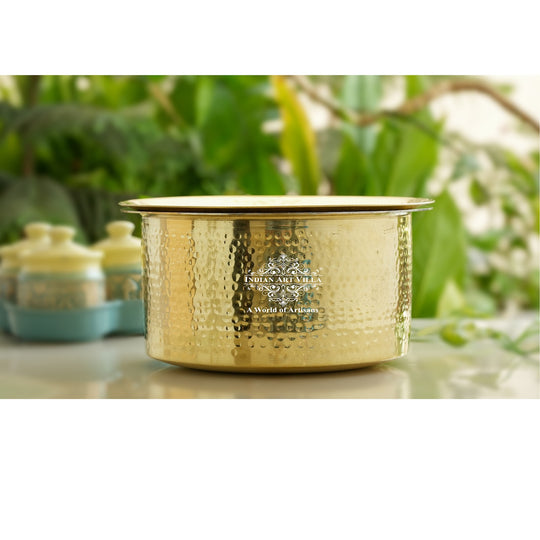 Decorative hammered brass patila with lid and tin coated interior often used for weddings feasts and festive celebrations