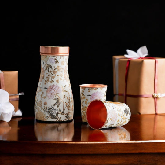 Golden floral design copper bottle and tumbler set by Indian Art Villa, ideal for festive décor and premium gifts.