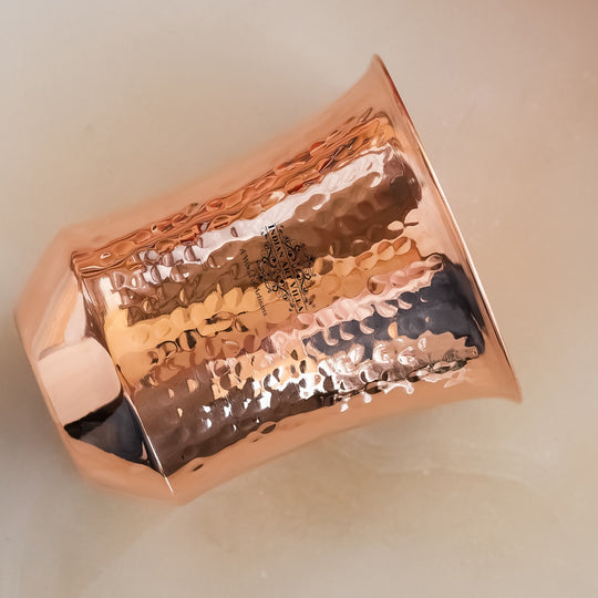 Embossed copper drinking glass artisan crafted India