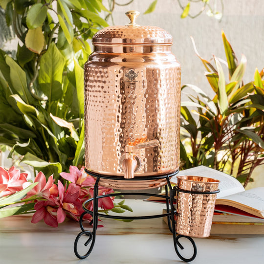 5 litre round copper matka on stand in living room as traditional décor water vessel – tamba matka