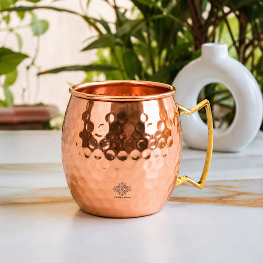 Polished pure copper cocktail mug with classic hammered detailing