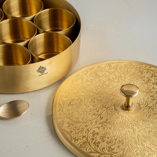 Premium pure brass spice box with engraved lid and seven inner containers for Indian kitchen use