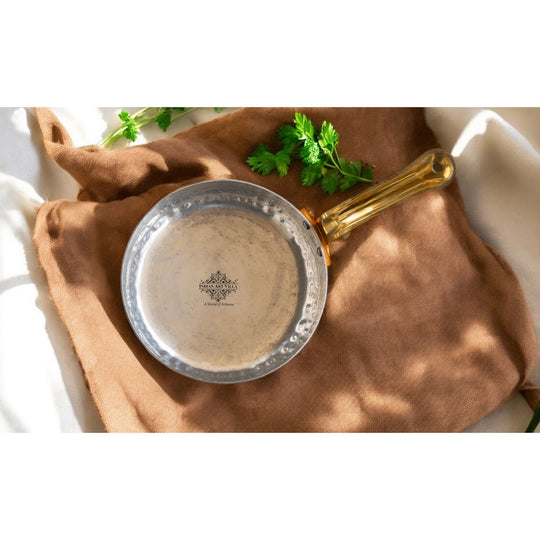 Indian Art Villa’s handcrafted copper round pan with tin lining combines age-old techniques with contemporary style