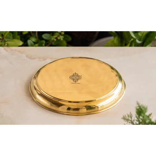 Floral embossed brass plate in round shape with raised rim and engraved detailing made by Indian Art Villa
