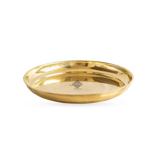 Elegant brass thali in floral embossed pattern round flat base and reflective polished body by Indian Art Villa
