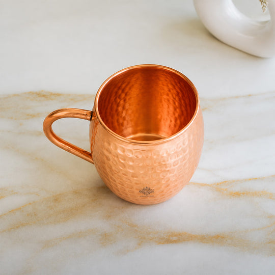 Hammered copper Moscow Mule mug with round shape and sturdy handle