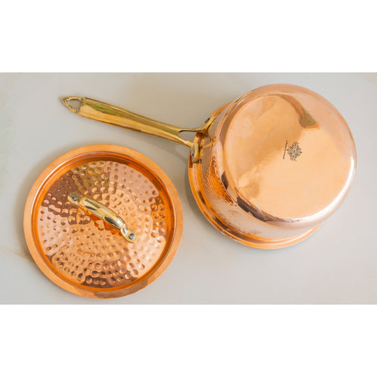 Long handle hammered copper pan with lid from Indian Art Villa perfect for display in curated traditional kitchenware