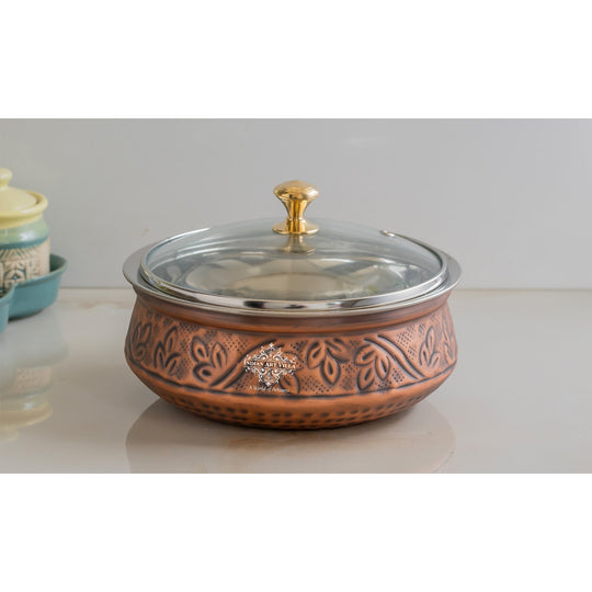 Indian Art Villa copper handi offering embossed elegance and antique charm with a crystal clear glass lid finish