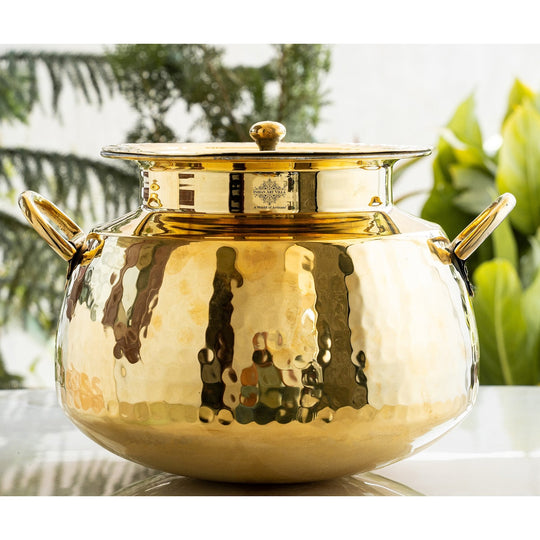Decorative hammered brass handi pot with lid and tin lining crafted as timeless cookware for authentic Indian preparation